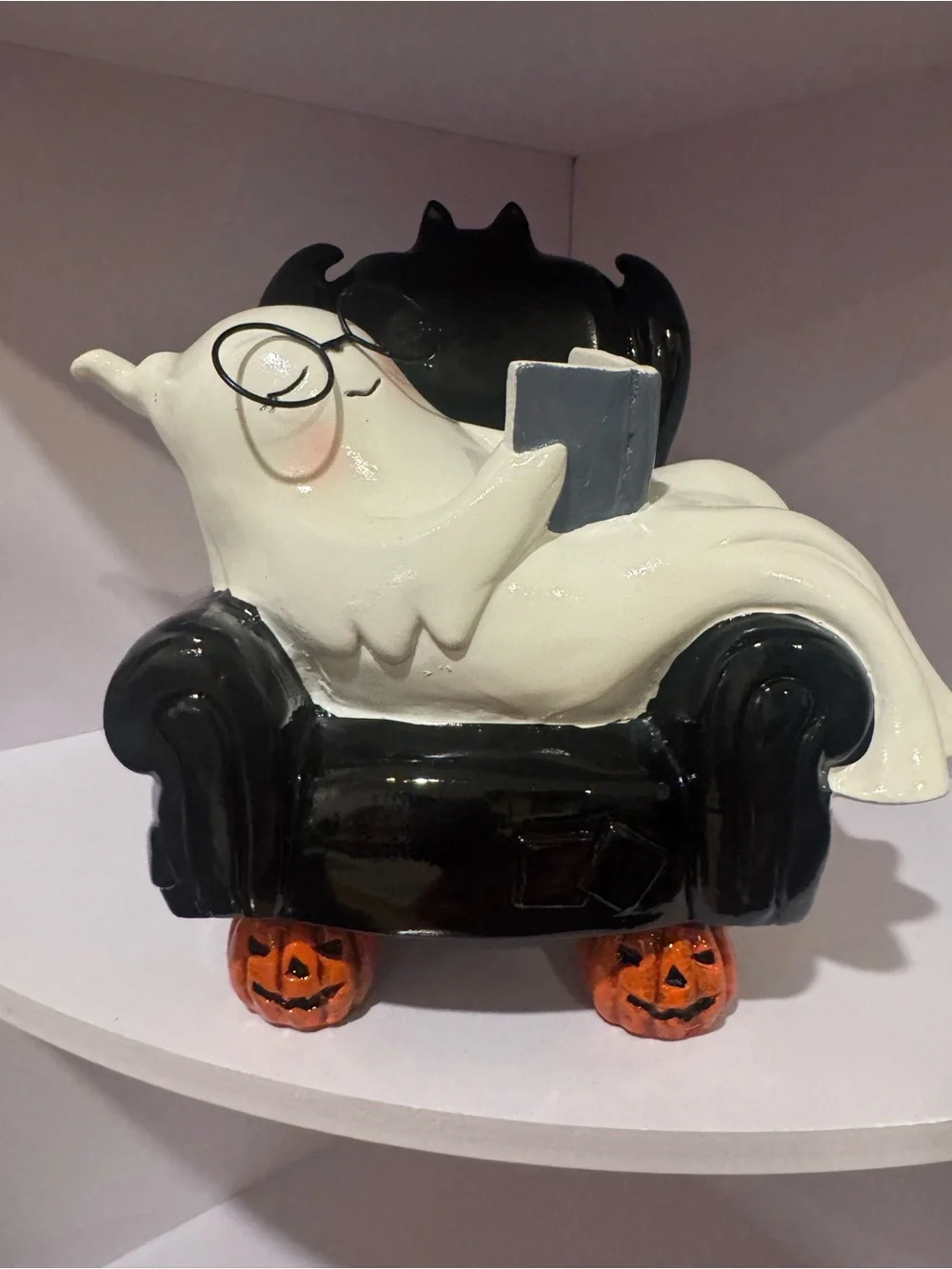 White Ghost Figurine on Black Chair Halloween Décor